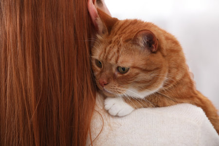 Woman with her cute cat, closeup viewの写真素材