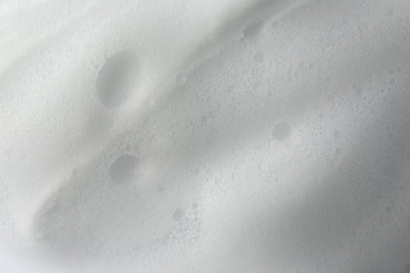 Foam as background, closeup. Face cleanser, skin care cosmeticの写真素材