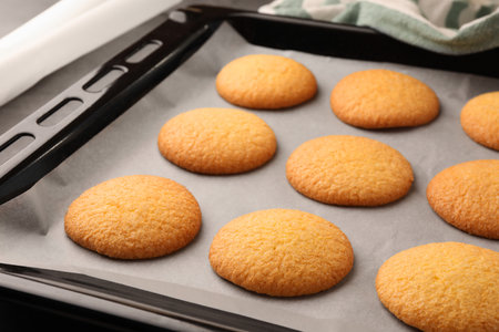 Delicious Danish butter cookies on baking tray, closeup
