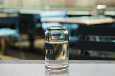 Glass of fresh water on table indoorsの写真素材