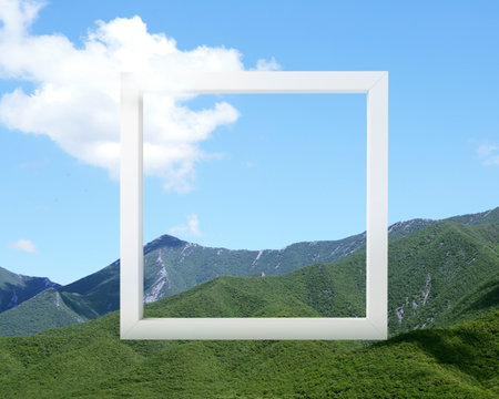Wooden frame and beautiful mountains under blue sky with cloudの写真素材