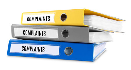Colorful folders with Complaints labels on white backgroundの写真素材