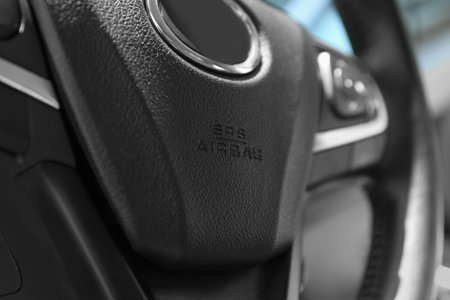Safety airbag sign on steering wheel inside car, closeupの写真素材