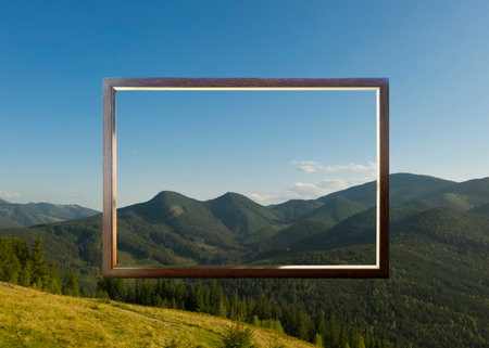 Wooden frame and beautiful mountains under blue skyの写真素材