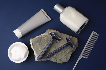 Flat lay composition with shaving accessories for men on blue backgroundの写真素材