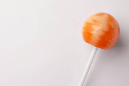 Tasty lollipop on white background, top view. Space for textの写真素材