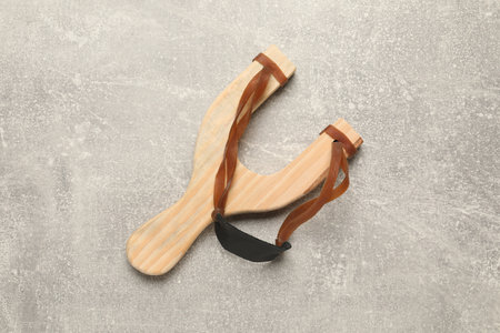 Slingshot with leather pouch on light gray background, top viewの写真素材