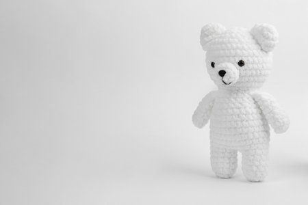 Cute crochet bear isolated on white. Children's toysの写真素材