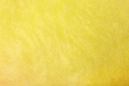 Sweet yellow cotton candy as background, closeupの写真素材