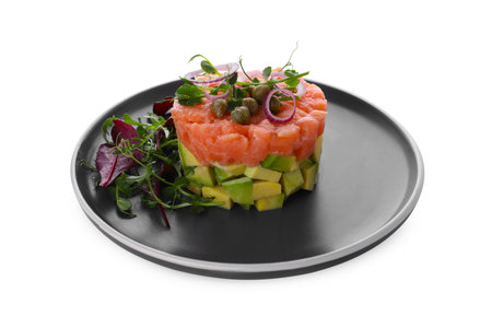 Tasty salmon tartare with avocado and greens isolated on whiteの写真素材