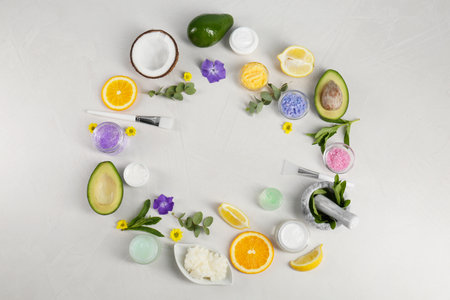 Frame made of homemade cosmetic products and fresh ingredients on light gray background, flat lay. Space for textの写真素材
