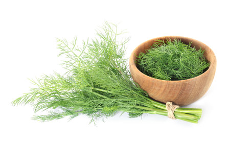 Bowl and bunch of fresh dill isolated on whiteの写真素材