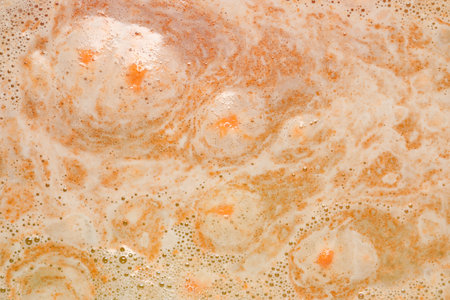 Colorful foam after dissolving bath bomb in water, closeupの写真素材