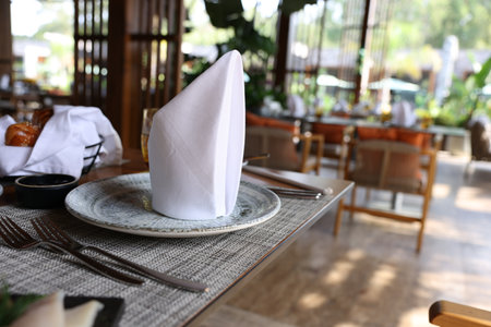 Dishware and cutlery on table in cafeteria, closeup. Breakfast, lunch or dinner timeの写真素材