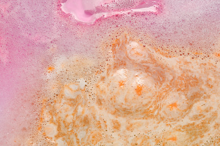 Colorful foam after dissolving bath bomb in water, closeupの写真素材