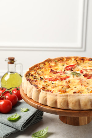 Tasty quiche and products served on light table, space for textの写真素材