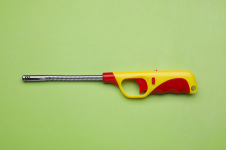 One gas lighter on green background, top viewの写真素材