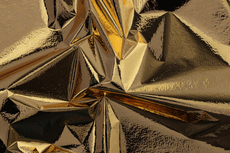 Edible gold leaf sheet as background, closeupの写真素材