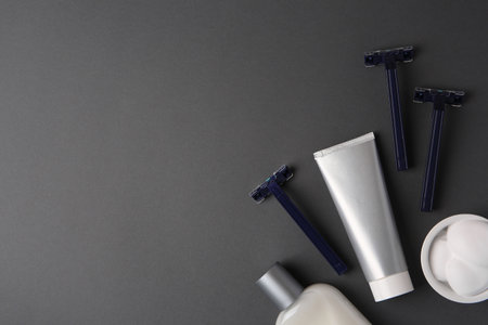 Flat lay composition with shaving accessories for men on gray background. Space for textの写真素材