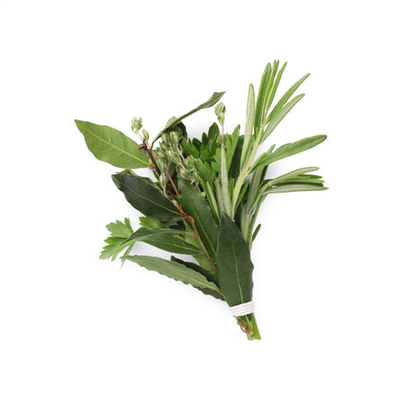 Bundle of aromatic bay leaves and different herbs isolated on white, top viewの写真素材