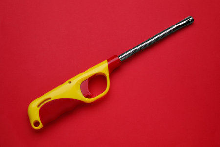 One gas lighter on red background, top viewの写真素材