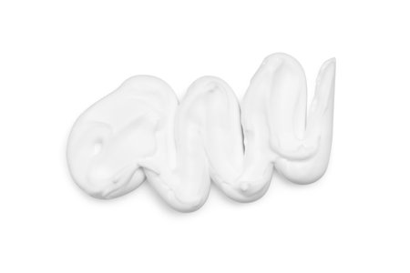 Smear of shaving foam isolated on white, top viewの写真素材
