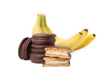 Tasty banana choco pies and fresh fruits isolated on whiteの写真素材