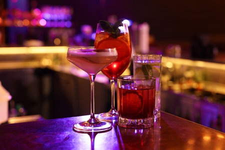 Fresh alcoholic cocktails on counter in bar