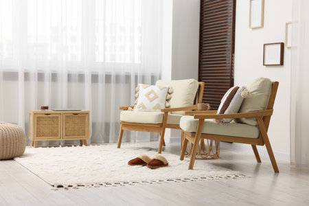 Stylish living room with soft white carpet and furniture. Interior designの写真素材