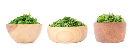 Set with cut parsley in bowls isolated on whiteの写真素材