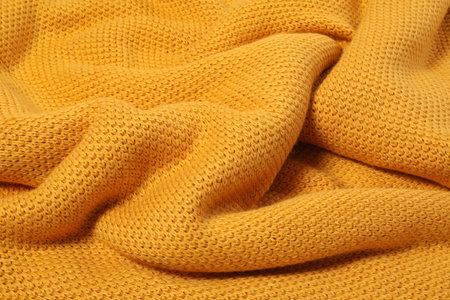 Texture of yellow knitted blanket as background, closeupの写真素材