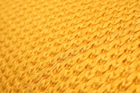 Texture of yellow knitted blanket as background, closeupの写真素材