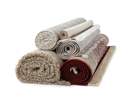 Rolled carpets on white background. Interior elementの写真素材