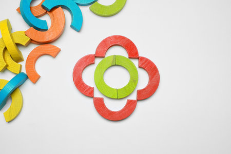 Colorful wooden pieces of play set on white background, flat lay. Educational toy for motor skills...