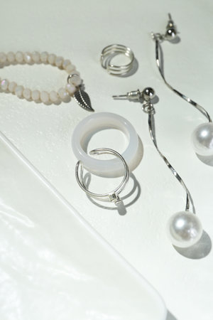 Different elegant bijouterie on white table, closeupの写真素材