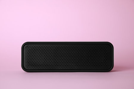 One portable bluetooth speaker on pink background. Audio equipmentの写真素材