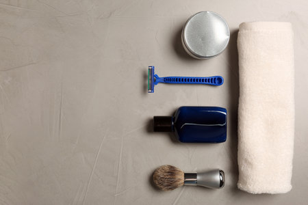 Set of men's shaving tools on light gray textured table, flat lay. Space for textの写真素材