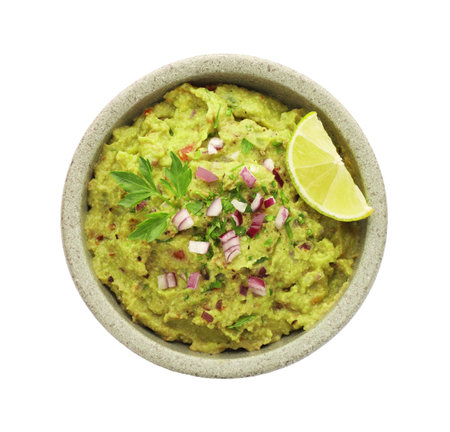 Bowl of delicious guacamole with lime isolated on white, top viewの写真素材
