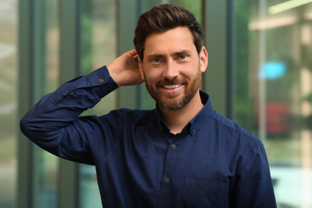 Portrait of handsome stylish man in office