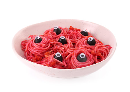 Red pasta with decorative eyes and olives in bowl isolated on white. Halloween foodの写真素材