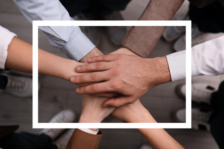 Partnership, union and cooperation. Businesspeople joining hands together, top view
