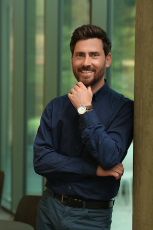 Portrait of handsome stylish man in office