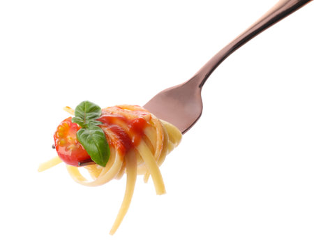 Fork with tasty pasta, tomato sauce and basil isolated on whiteの写真素材