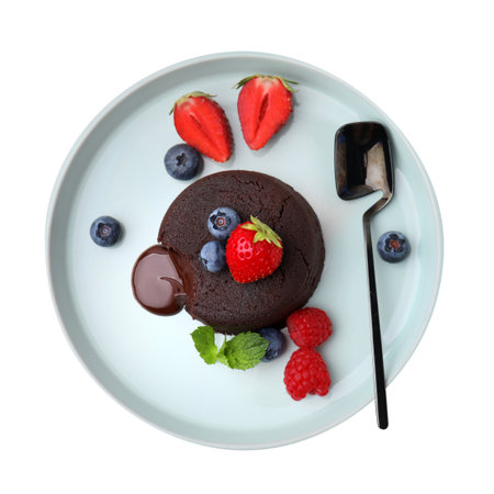 Plate with delicious chocolate fondant, berries and mint isolated on white, top viewの写真素材