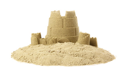 Pile of sand with beautiful castle isolated on whiteの写真素材