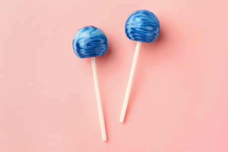 Tasty lollipops on pink background, flat layの写真素材