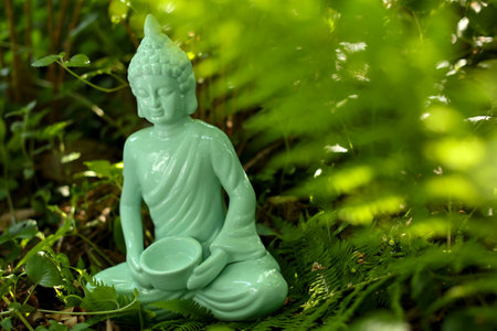 Decorative Buddha statue outdoors. Space for textの写真素材