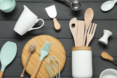Set of different kitchen utensils on gray wooden table, flat layの写真素材