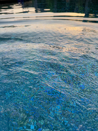 Clear rippled water in outdoor swimming pool