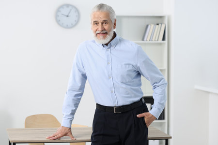 Portrait of handsome senior man in officeの写真素材